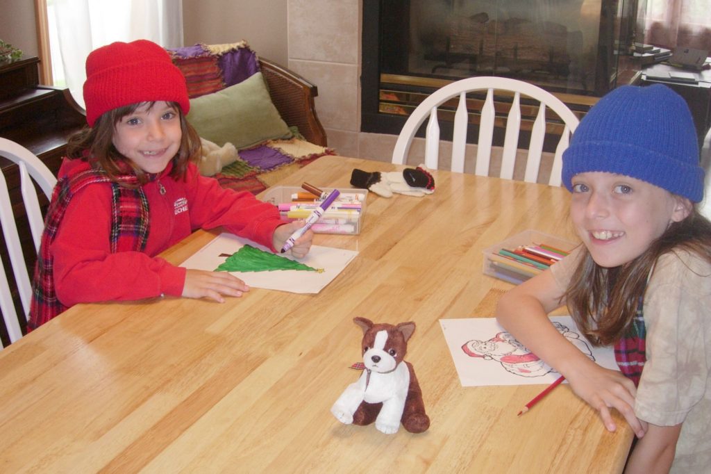 children coloring at kitchen table