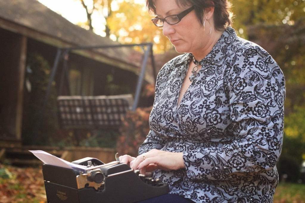 woman on a typewriter in the fall