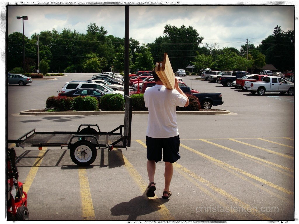 man carrying lumber from hardware store