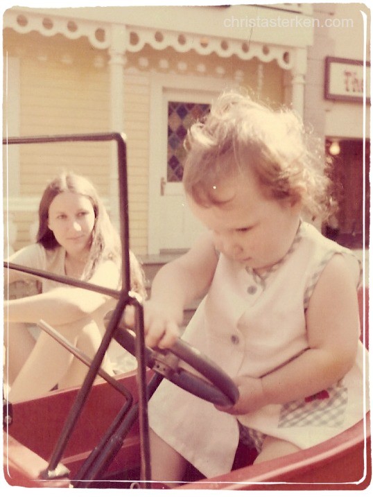vintage little girl and mom driving toy car
