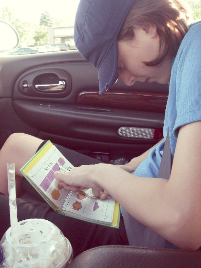 child playing games in the car