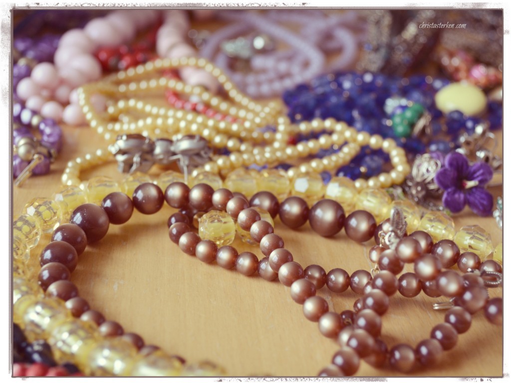 piles of vintage costume necklaces