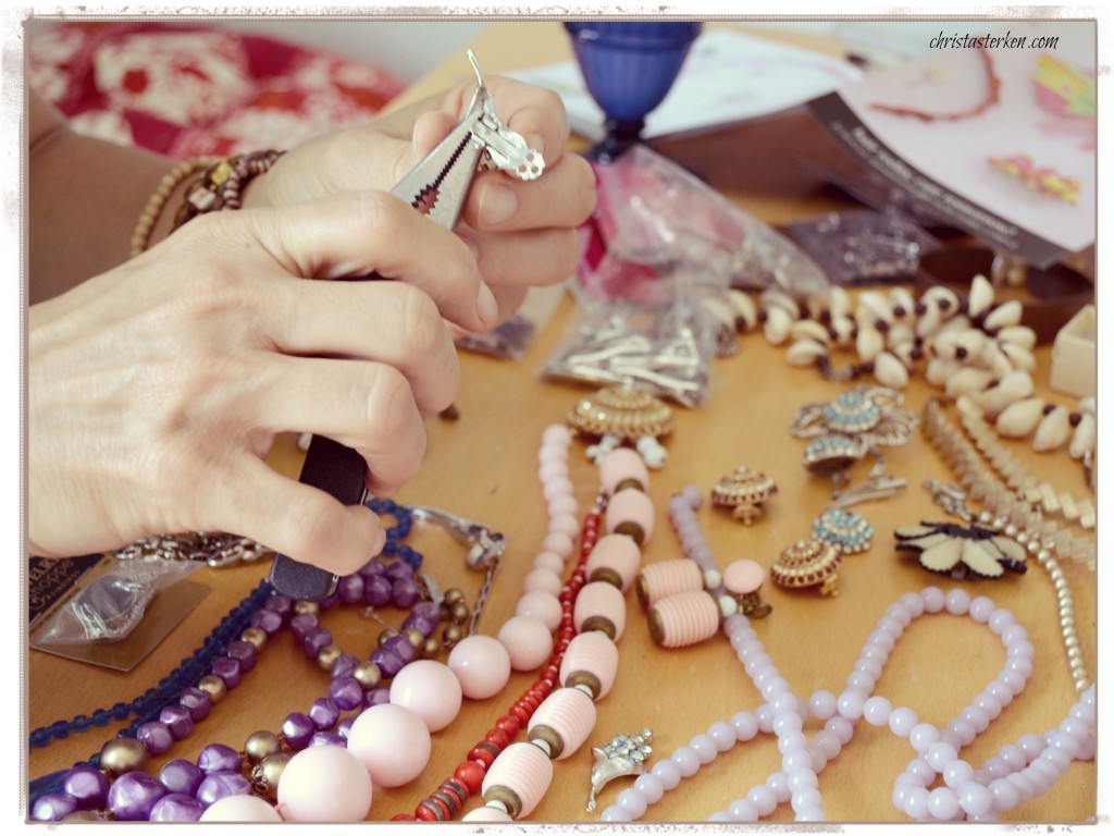 lady using pliers on costume jewelry