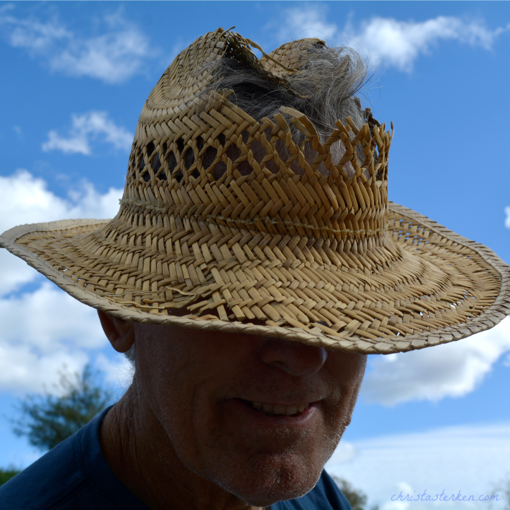 man in beat up work hat