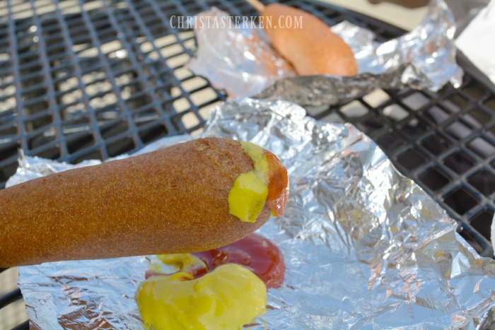 corn dog with ketchup and mustard