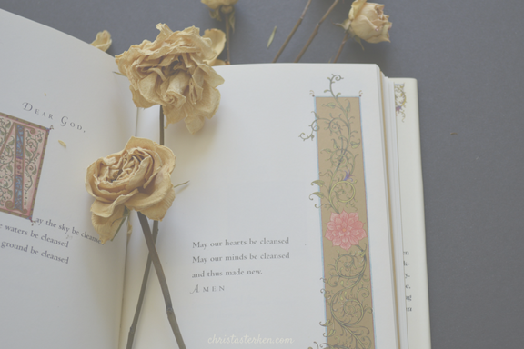 white flowers on an open antique book