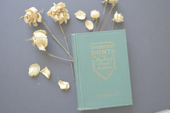 dried flowers with a vintage etiquette book