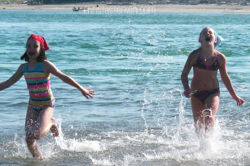 girls playing in ocean
