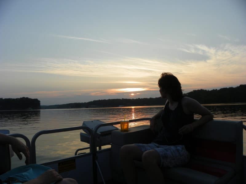riding on pontoon boat watching sunset