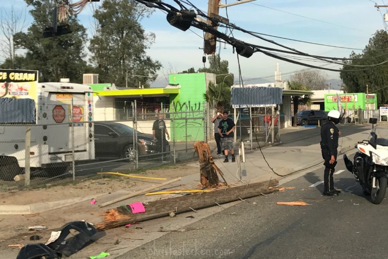 splintered telephone pole from car accident