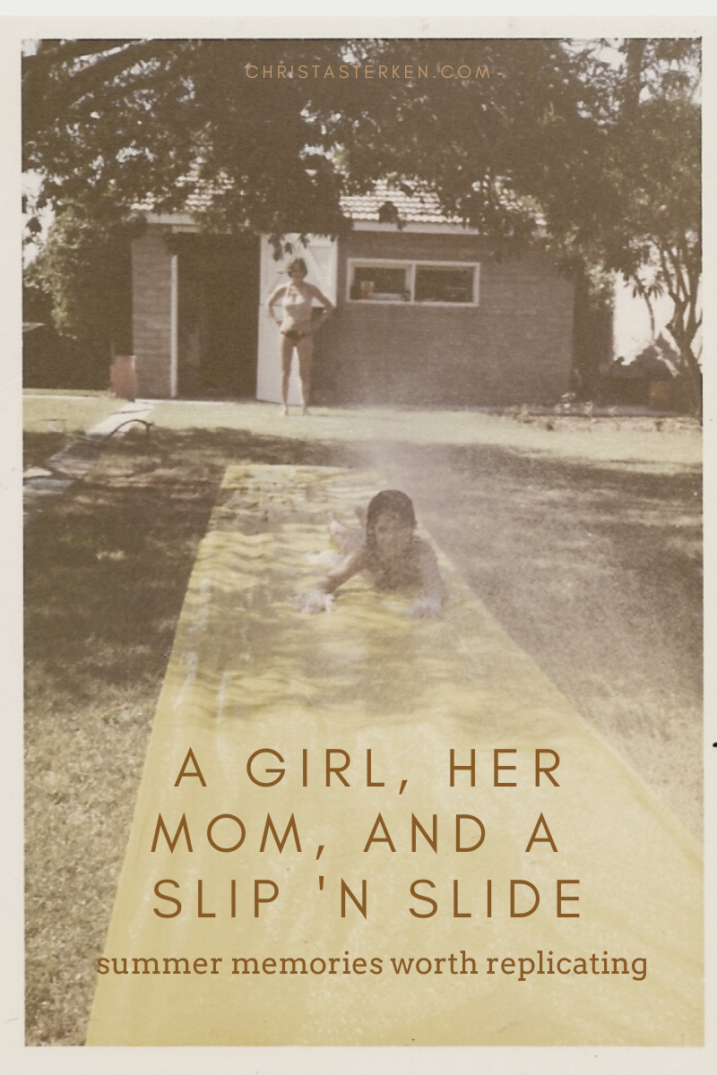a slip 'n slide, a girl, and her mother 