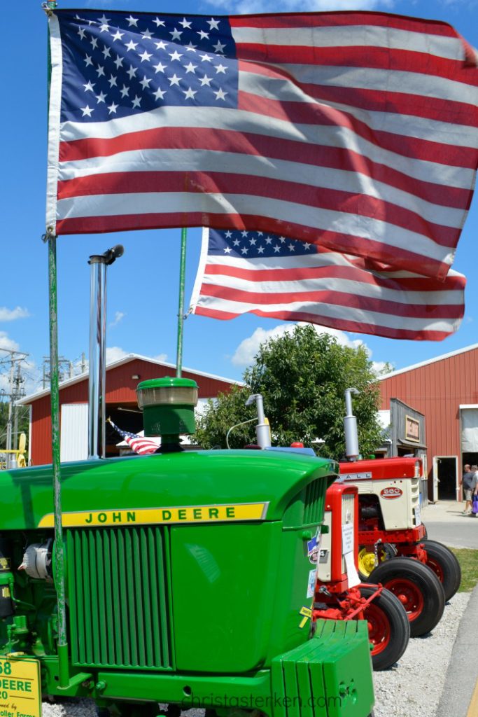 John Deere tractor and american flag at fair