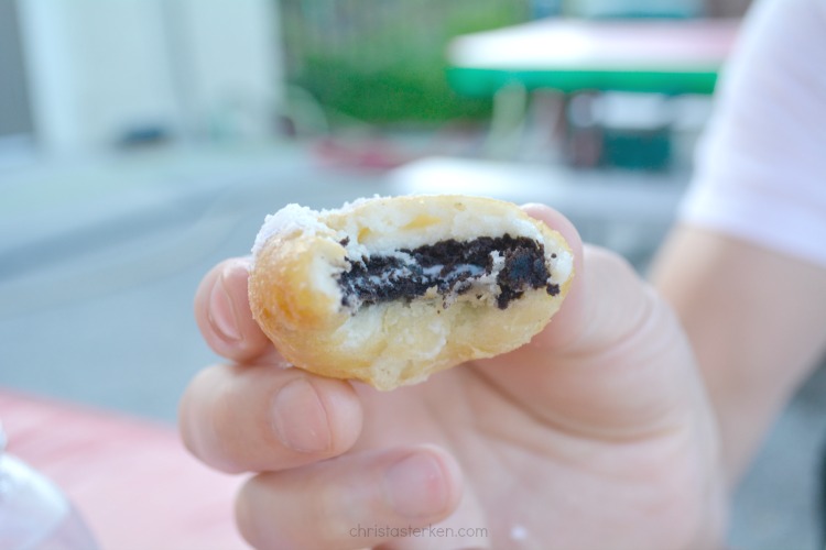 hand holding deep fried oreos