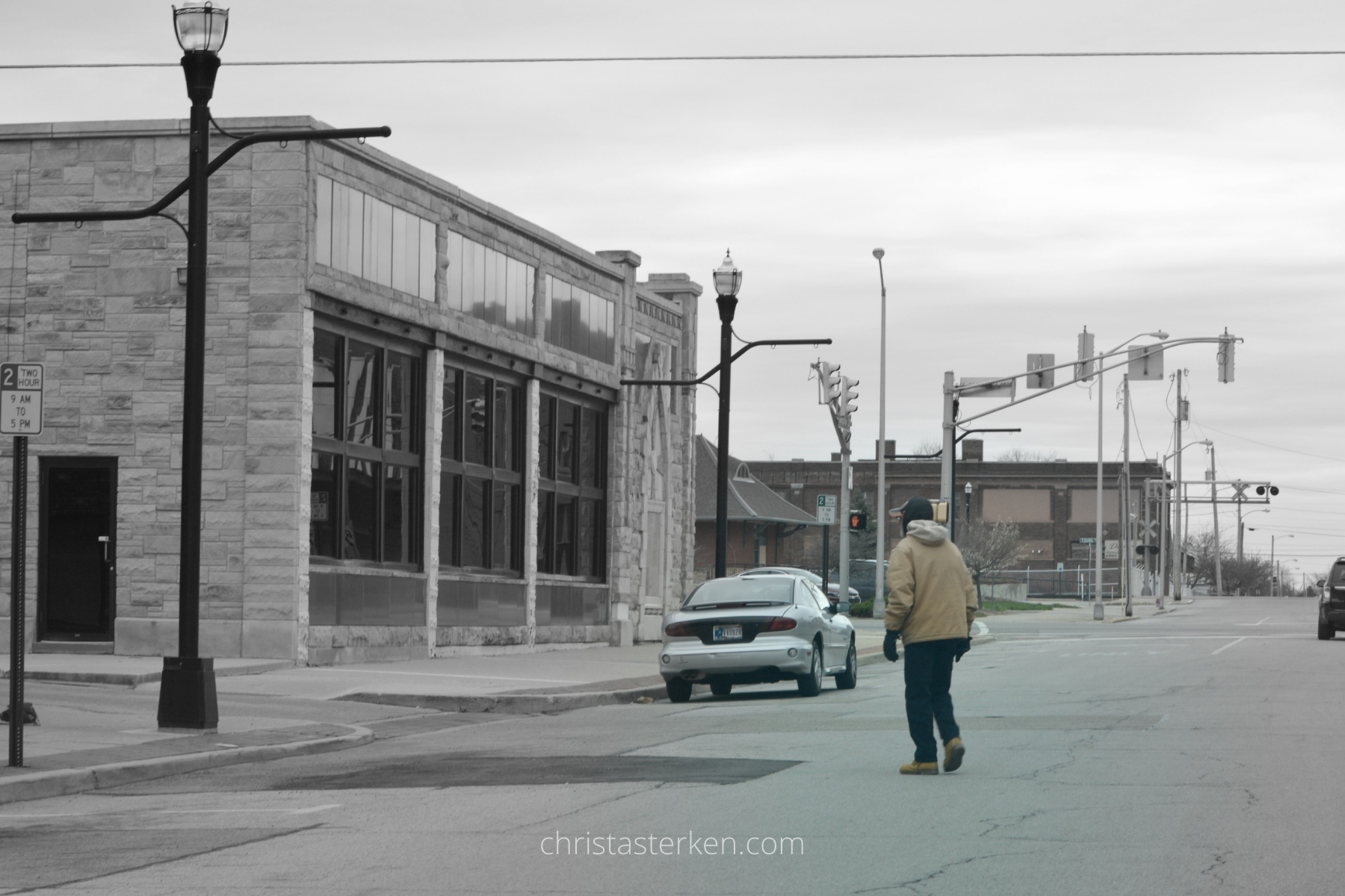 homeless man crossing the street