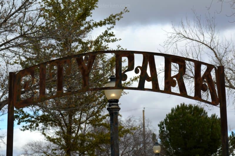 Tombstone metal city park sign