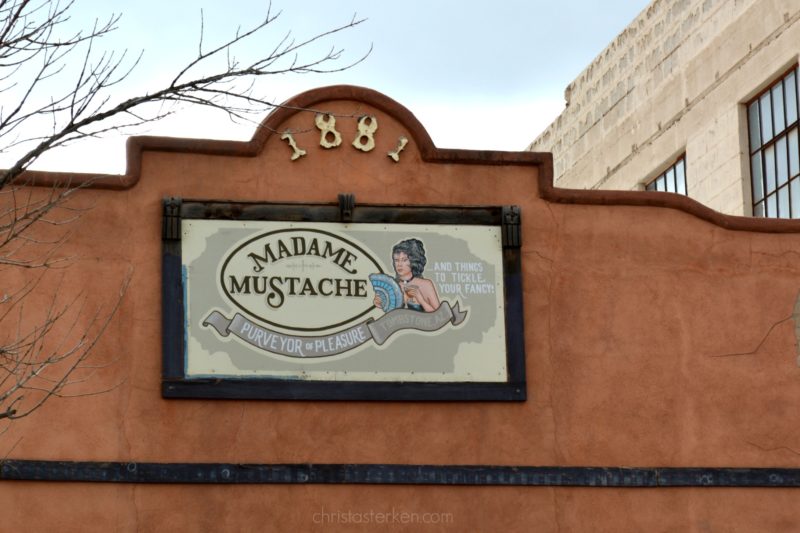 Madame mustache sign