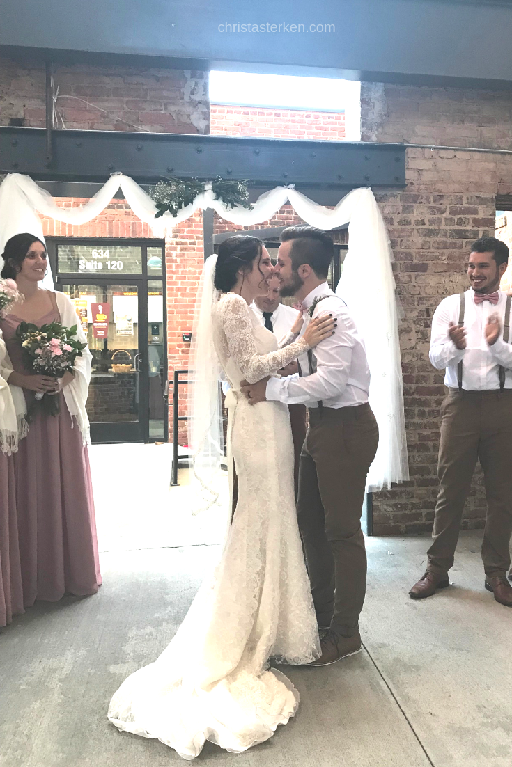 couple kissing at after saying I do