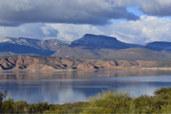 lake marina with snowy mountains in background