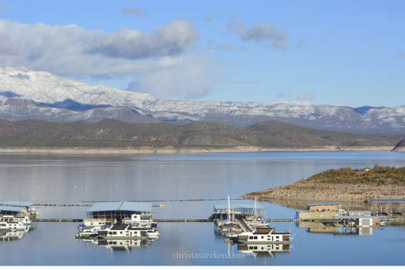 lake marina with snowy mountains in background