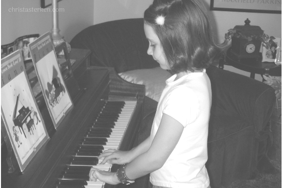 little girl playing piano