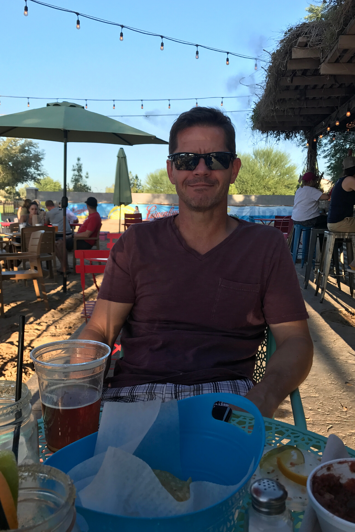 man enjoying a beer and dinner