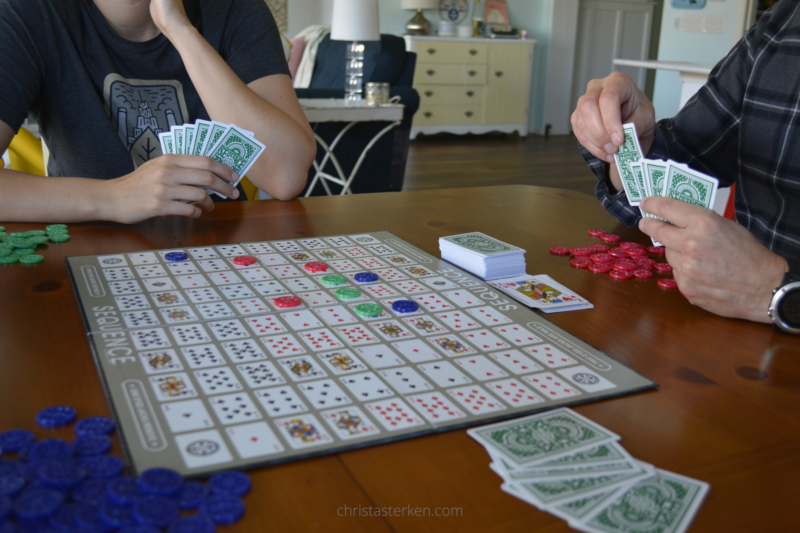 family playing board game