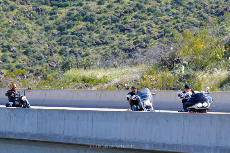 motorcyles driving across bridge