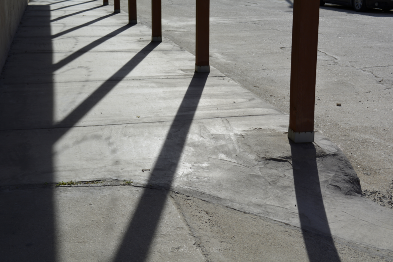 shadows on boardwalk in mining town