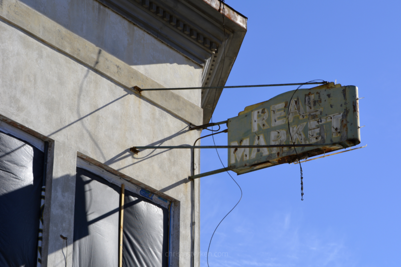 abandoned market sign in mining town