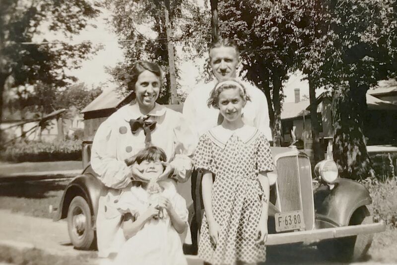 vintage picture of a mom dad and two young children