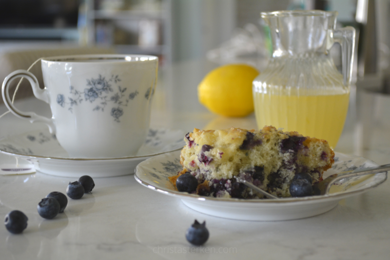 blueberry pudding and cup of tea on china