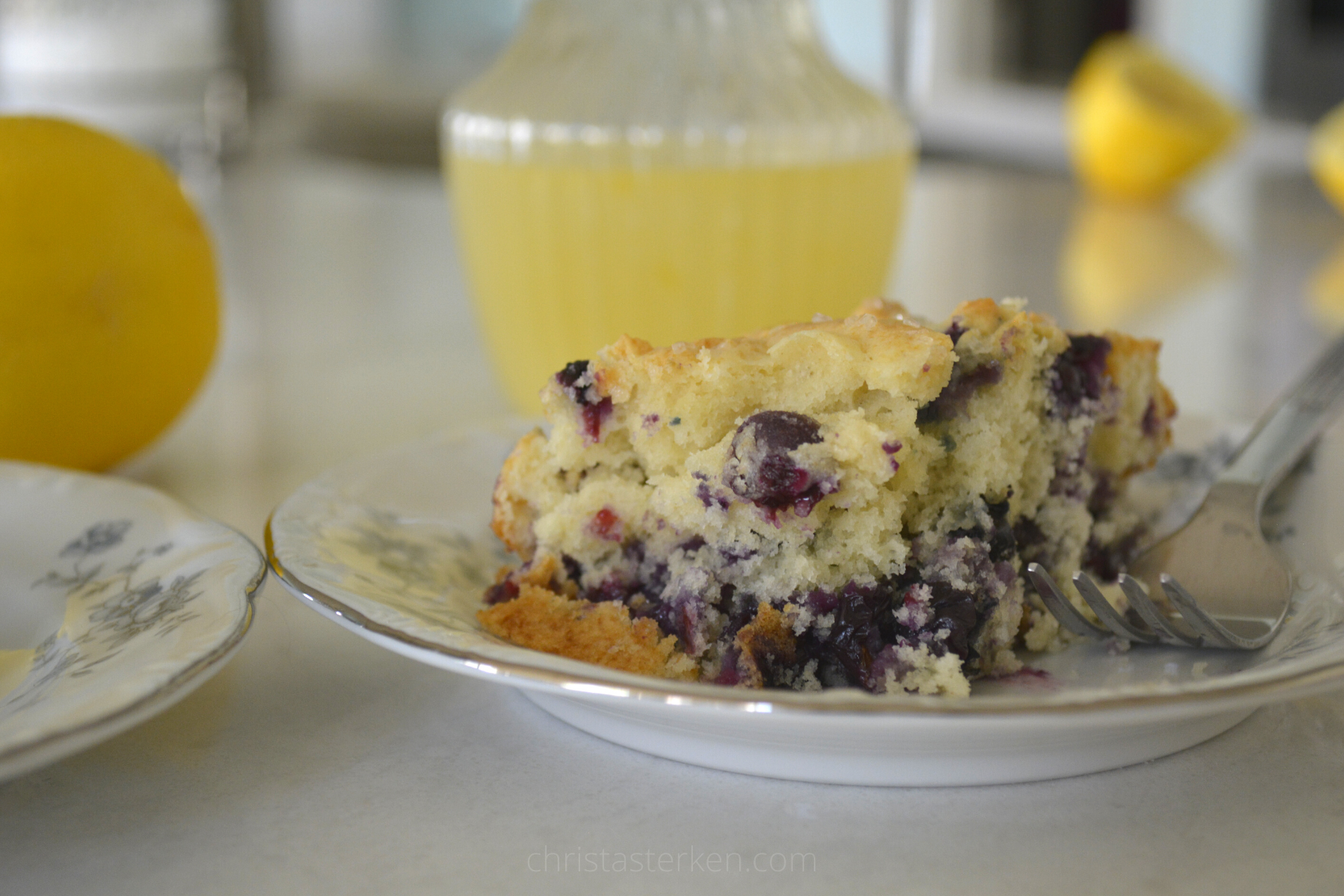 blueberry pudding with lemon sauce on saucer