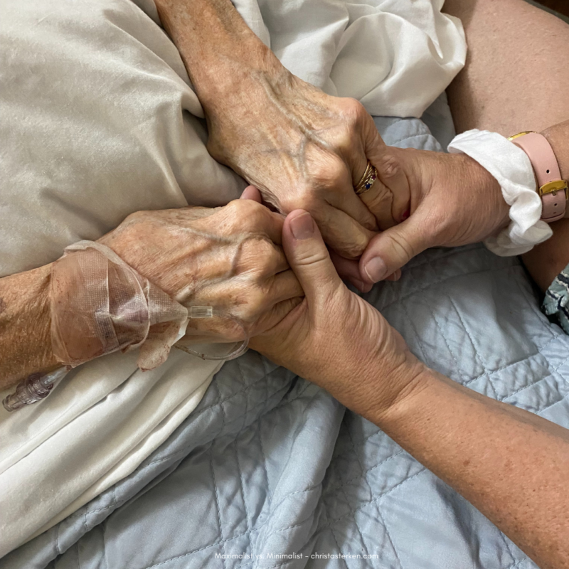 holding hands of elderly